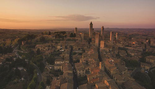 High angle view of city buildings during sunset