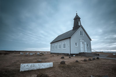 Built structure against cloudy sky