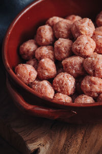 High angle view of raspberries in bowl on table