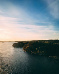 Scenic view of sea against sky at sunset