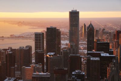 Aerial view of city at sunset