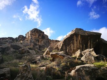 Panoramic view of rock formations against sky