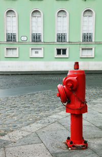 Red fire hydrant in city