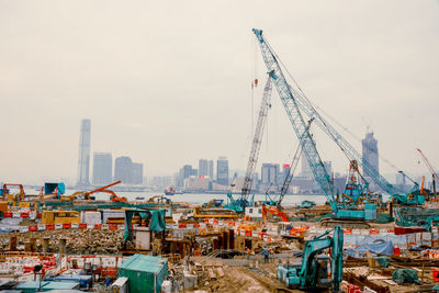 Cranes and machinery at victoria harbour in city