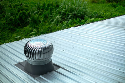 High angle view of metallic structure on field