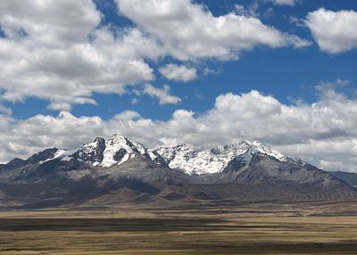 Scenic view of snowcapped mountains against sky