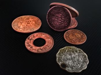 High angle view of coins on table