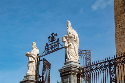 Low angle view of statue against sky