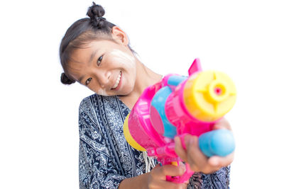 Portrait of a smiling girl holding toy
