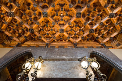 Low angle view of illuminated ceiling of building