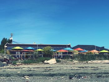 Built structures against clear blue sky