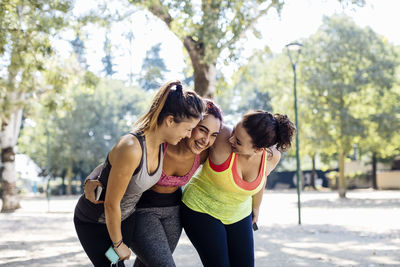 Diverse sportswomen having fun in park