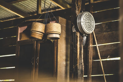 Baskets hanging beside cabinet at home