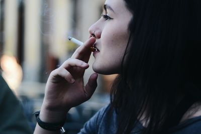 Close-up of woman smoking cigarette