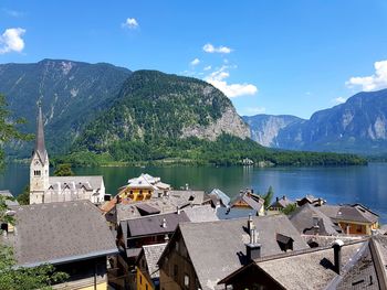 Panoramic view of hallstatt lake and buildings against sky