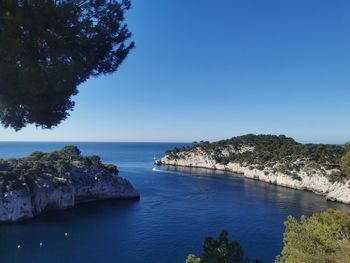 Scenic view of sea against clear blue sky