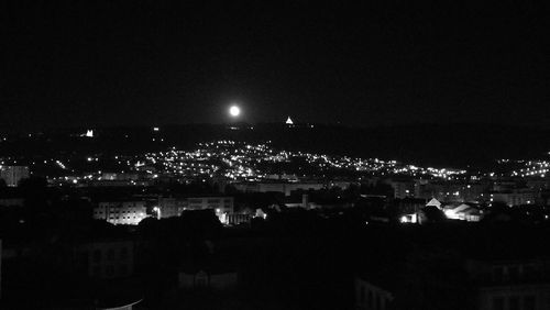 High angle view of illuminated buildings in city at night