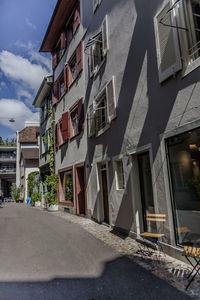 Houses in town against sky