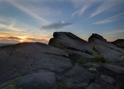 Scenic view of rock formations at sunset