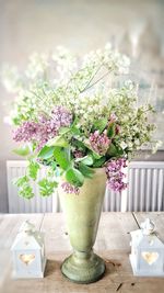 Flower vase on table