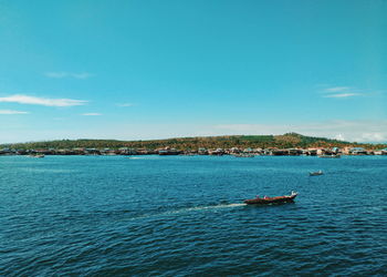 Scenic view of sea against blue sky