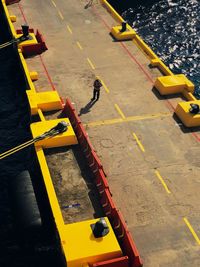 High angle view of man crossing road