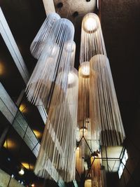 Low angle view of illuminated lights hanging on ceiling