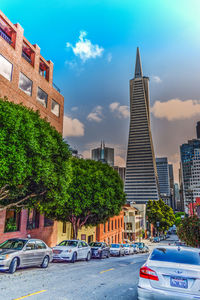 Buildings in city against sky