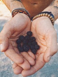 Close-up of hand holding strawberry