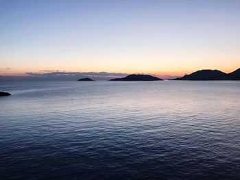 Scenic view of sea against sky at sunset