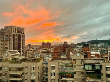 High angle view of buildings against sky during sunset