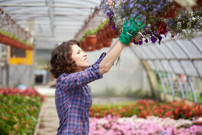 Woman working in greenhouse