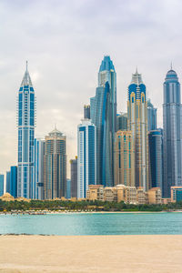 Skyscrapers in city against sky