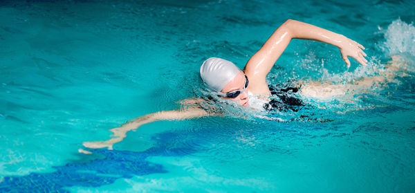 Woman swimming in pool