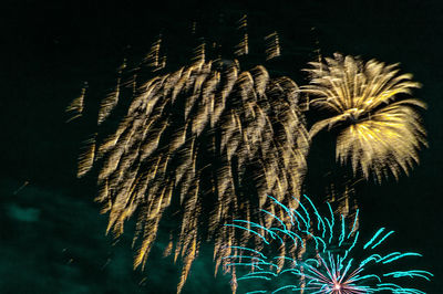Low angle view of illuminated lights at night
