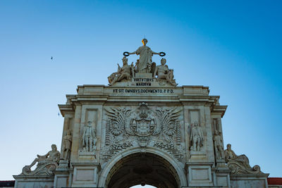 Low angle view of historical building against clear blue sky