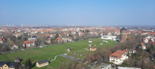 View of townscape against clear sky at the völkjerschlachtdenkmal. there's also a water tower.