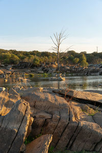 Scenic view of river against clear sky