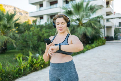 Young woman exercising in city