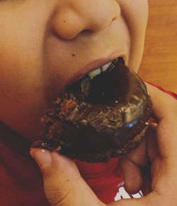 Midsection of woman holding ice cream