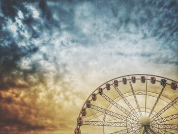 Low angle view of ferris wheel against sky