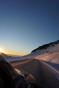 Scenic view of road against clear sky