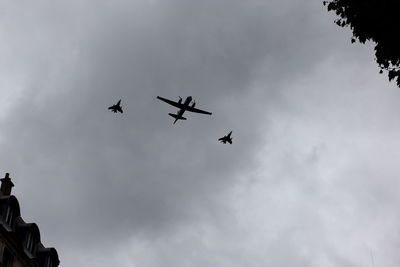 Low angle view of airplane flying in sky