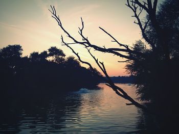 Scenic view of lake at sunset