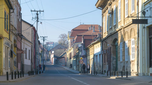 Road amidst buildings in city