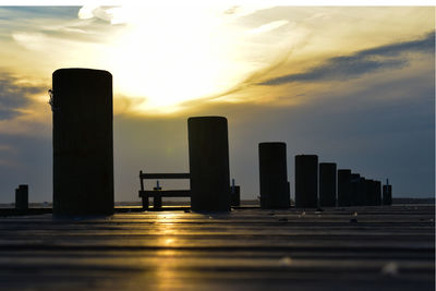 Silhouette buildings against sky during sunset in city