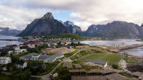 High angle view of townscape by sea against sky