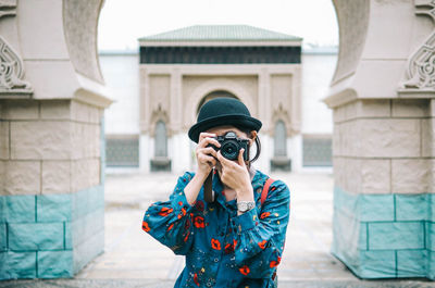 Full length of man photographing