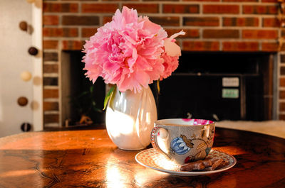 Close-up of flower vase on table at home