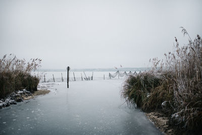 Scenic view of a frozen lake against clear sky